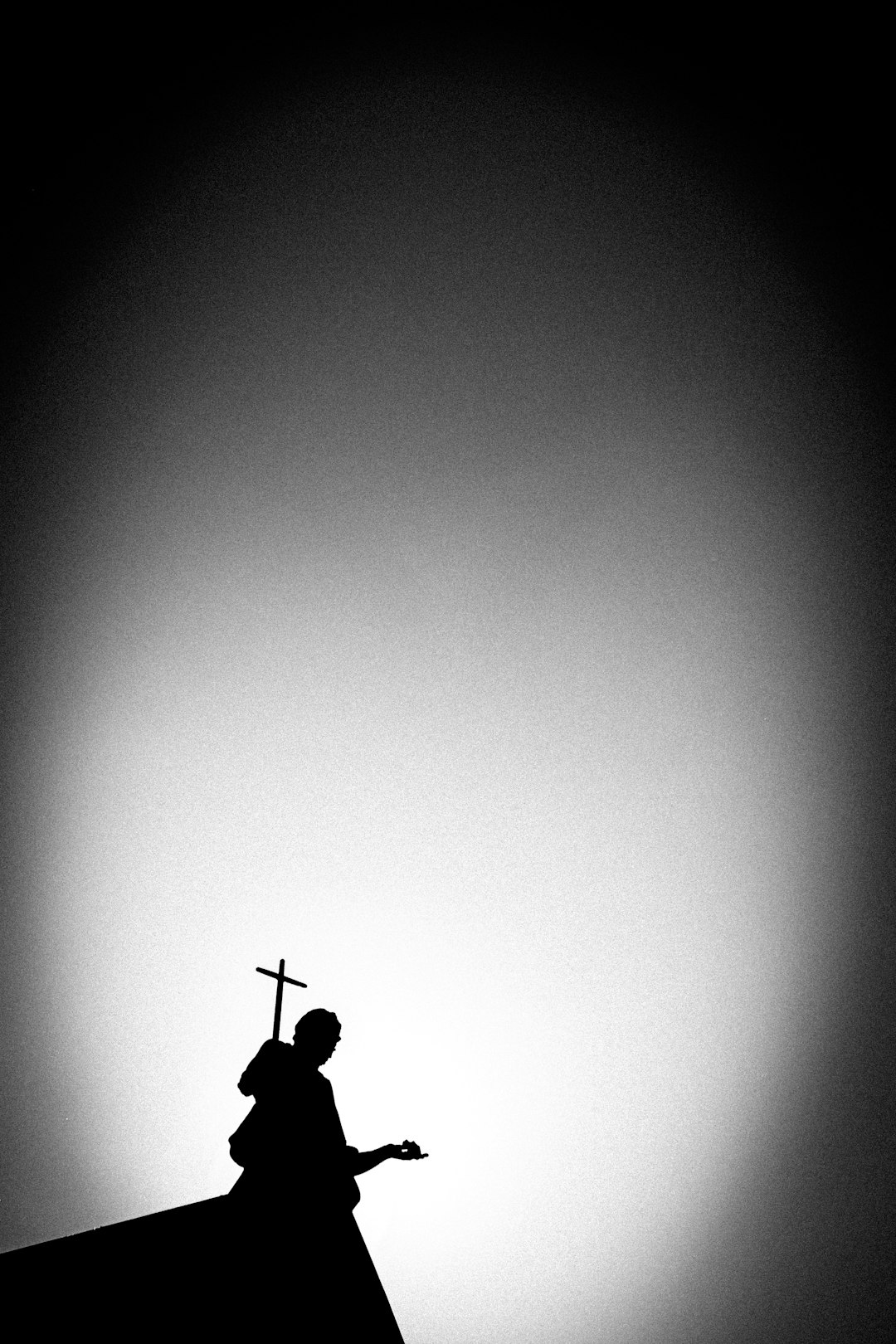 a-black-and-white-photo-of-a-church-steeple-ubahcympkdu